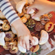 Children reaching for holiday cookies from platter
